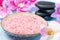 Pink sea salt, stones for spa, flowers and towels