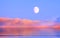 pink sea sunset at sea summer evening  moon on cloudy sky in sea water reflection  ocean  blue water and sun light go down beauti