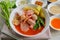 Pink seafood flat noodle Tom Yum Yen-Ta-Fo