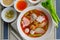 Pink seafood flat noodle Tom Yum Yen-Ta-Fo
