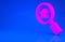 Pink Search house icon isolated on blue background. Real estate symbol of a house under magnifying glass. Minimalism