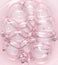 Pink serum oil with bubbles texture background. Cosmetic science lab product