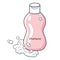 Pink shampoo bottle with foam