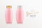 Pink shampoo products bottle with gold and silver cap, collections mock up template design background