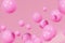 Pink shiny balls on peachy background