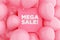 Pink sign frame with the message MEGA SALE surrounded with pink air balloons. Shopping price discount and promotion announcement