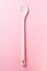 Pink silicone spoon on pink, from above