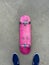 Pink Skateboard on Smooth Concrete Surface