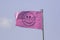 Pink smiley face flag