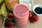 Pink smoothie made with strawberries, bananas, pears, tofu and maple syrup