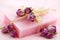 Pink soap with dried roses