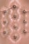 Pink soft leatherette background with symmetrical buttons. Soft and expensive furniture elements. Luxury background