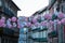 Pink Spherical Paper Lanterns Hanged in Porto Street among Houses, Portugal