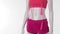 Pink sport shorts on mannequin.