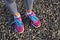 Pink sports shoes on gravel