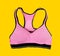 Pink sporty bra on yellow