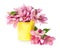 Pink spring flowers in yellow pail