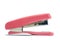 A pink stapler in white background