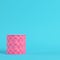 Pink stiched pedestal on bright blue background in pastel colors