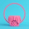 Pink stiched pedestal covered by fabric with round frame on bright blue background in pastel colors