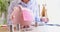 Pink sticker home budget hanging on piggy bank with coins closeup 4k movie