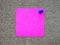 A pink sticky note post it writing,