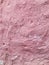 Pink stone rough old wall spray painted texture concrete background in retro style