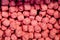 Pink strawberry rectangular candies background