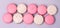 Pink Strawberry and White Caramel and Salt Macarons French Delicate Dessert Pink and White Pastel Macarons Long Top View