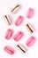 Pink Strawberry and White Caramel and Salt Macarons French Delicate Dessert Pink and White Pastel Macarons Vertical Flat Lay