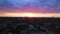 Pink sun city cloudy colorful sunset Berlin Smooth aerial top view flight drone