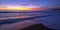 Pink sunset cloud reflection over Santa Clara river seaside marsh at Ventura beach in California USA