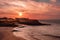 Pink sunset with clouds over the bay of Tarrafal village