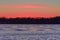 Pink Sunset on Lake in Winter
