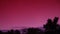 Pink sunset and nightfall filmed in timelapse.