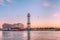 Pink sunset in the port of Barcelona and the steel Torre Jaume I tower