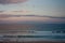 A pink sunset by the sea at a beach in Sydney