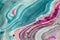 Pink and teal liquid ink swirl abstract background with ravishing wavy pattern.