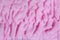 Pink textile terry background. Terry towel or bathrobe close up