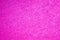 Pink texture of a cotton towel, clean straight line pattern of fiber. Fuchsia