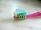 Pink toothbrush and paste