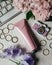 Pink tube for cream, cosmetics, flowers, gold rings. Life style