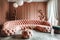 Pink tufted curved round sofa and pouf against terra cotta classic wall panels. Art deco style home interior design of modern