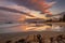 Pink twilight over wet sand beach