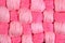 Pink twisted skeins of floss as background texture