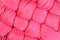 Pink twisted skeins of floss as background texture