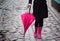 Pink umbrella and pink rubber boots