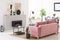 Pink velvet couch standing in real photo of Scandinavian style l