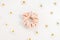 Pink velvet scrunchie and spring daisy flowers on white background