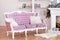 Pink velvet sofa with buttons and fluffy pillows